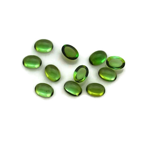 Pine green tourmaline cabochon oval cut 6x4mm gemstone. 